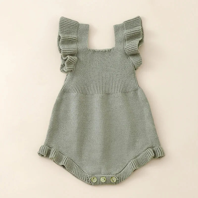 Green ruffle knit romper for babies with button closure and flutter sleeves for infants