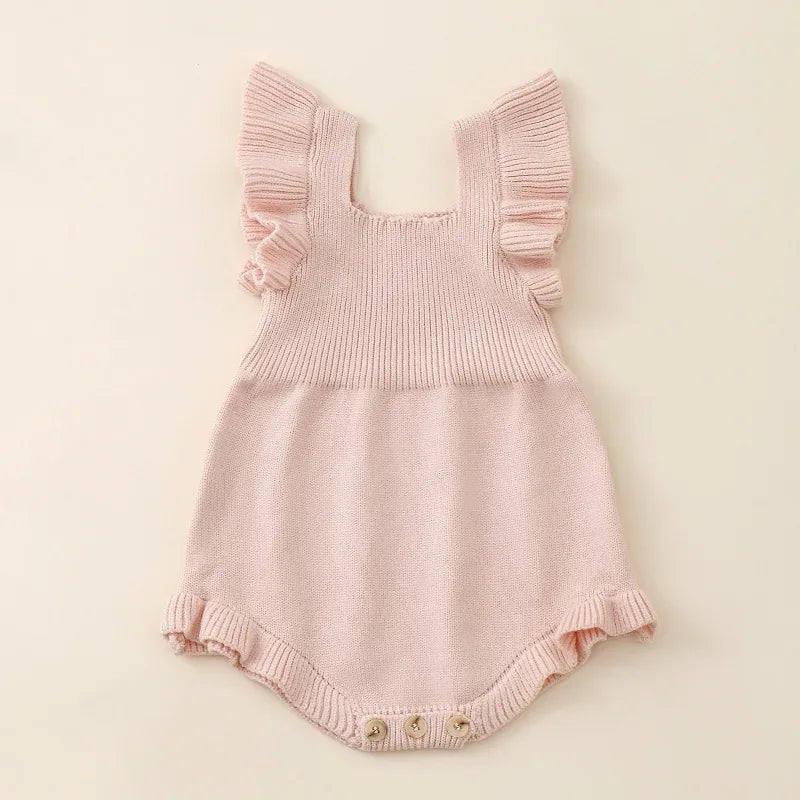 Pink ruffle knit romper for babies with sleeveless design and button closure for newborns
