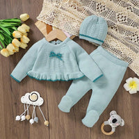 Light blue knitted baby outfit set for infants with bow detail and matching hat
