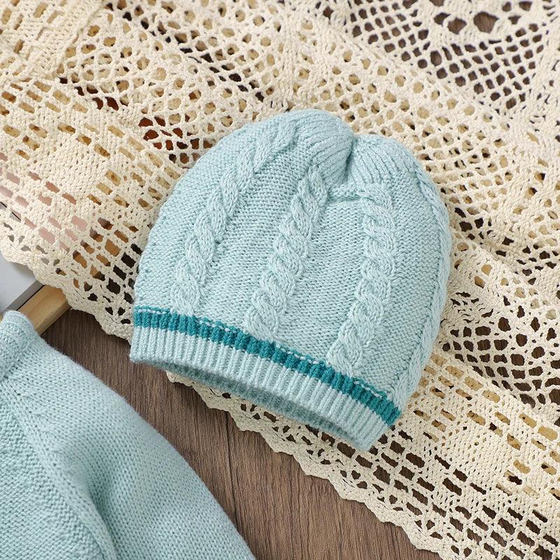 Light blue knitted baby outfit set with cable knit hat for newborns with teal stripe detail