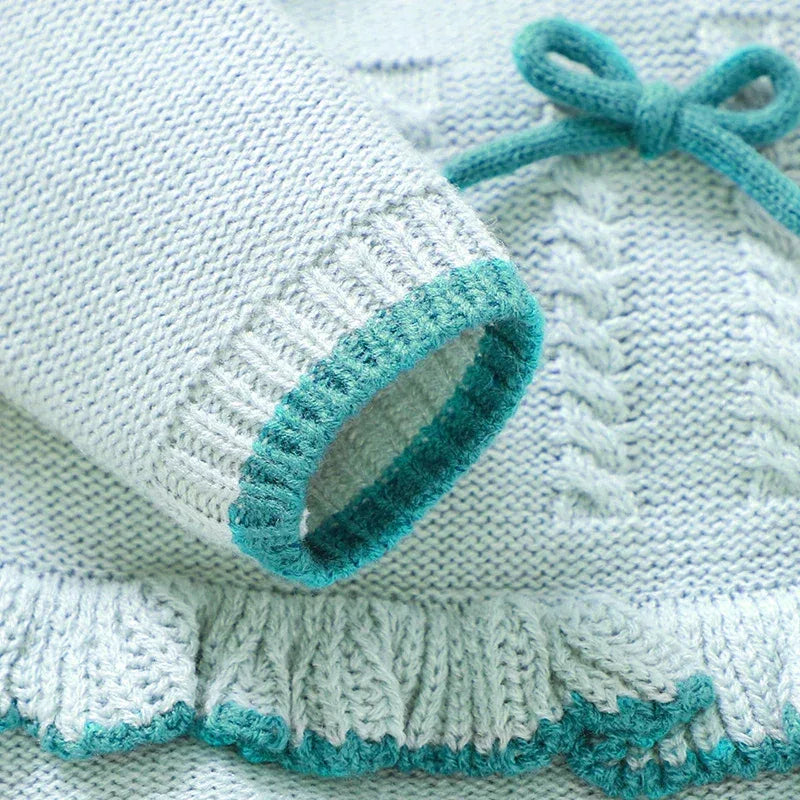 knitted baby outfit set in light blue with teal trim, cable knit detail for newborns
