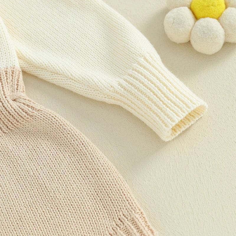 cream and beige knitted baby romper for infants with long sleeves and ribbed cuffs