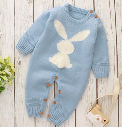 Baby blue knitted baby romper with bunny design for infants with long sleeves and button details