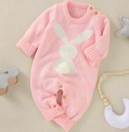 pink knitted baby romper with bunny design, long sleeve, newborn size with button details