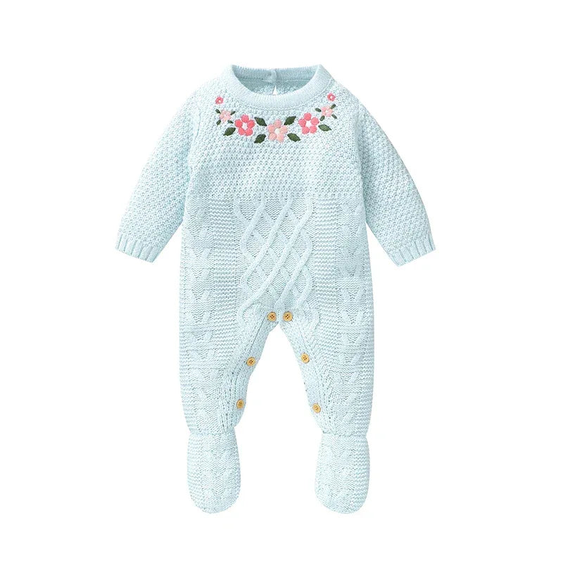 Light blue knitted baby romper with feet featuring floral embroidery for newborns