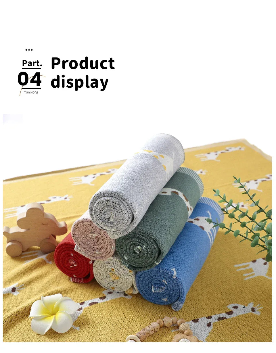 Colorful knitted giraffe baby blanket in multiple colors with giraffe pattern for babies and kids