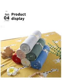 Colorful knitted giraffe baby blanket in multiple colors with giraffe pattern for babies and kids