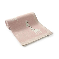 Pink knitted giraffe baby blanket with white and brown giraffe design for infants
