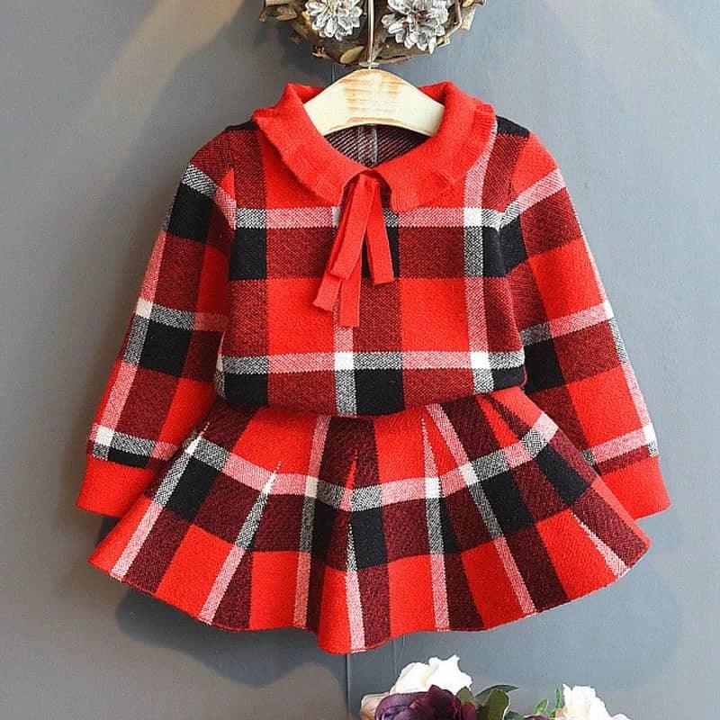 Red and black knitted girls plaid skirt set made of soft knit material with long sleeves and a bow collar