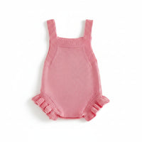 Pink knitted newborn romper for babies with ruffled leg openings and sleeveless design