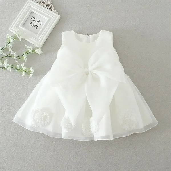 White lace and tulle toddler dress with large bow and floral appliques for baby girls