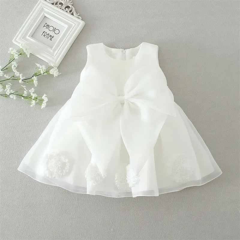 White lace and tulle toddler dress with large bow and floral appliques for baby girls