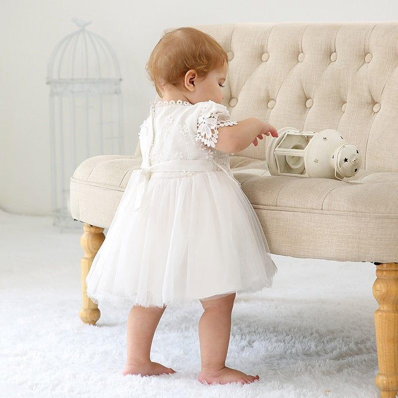 White lace baby girl dress for infants with tulle skirt and floral lace sleeves