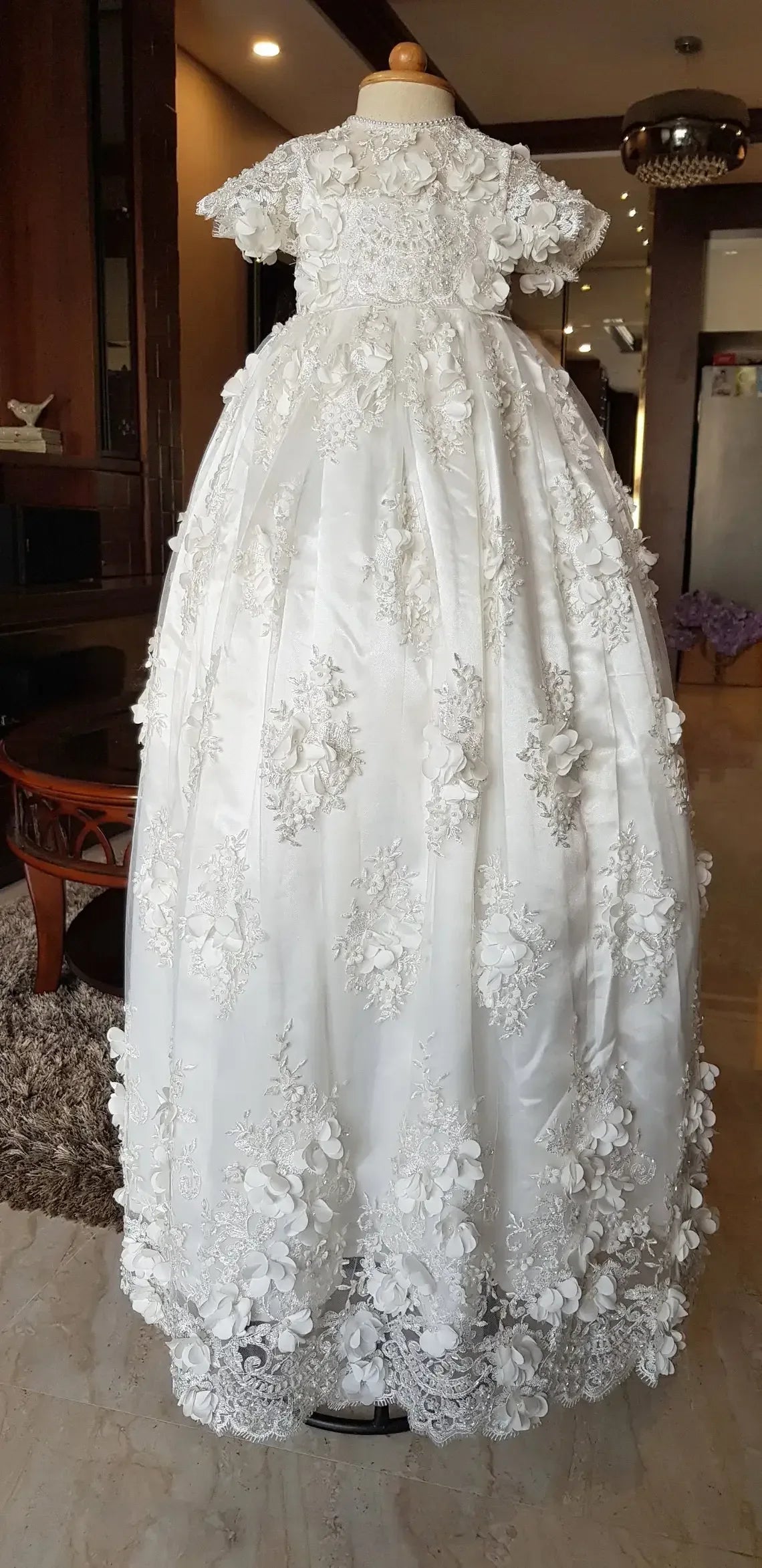 White lace baptism gown for babies with short sleeves and floral lace detailing