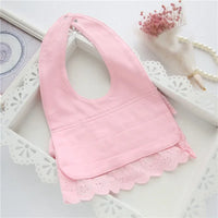 pink lace bib for babies laid flat with floral trim for infants and toddlers