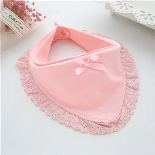 soft pink lace bib for babies with delicate bow detail and scalloped edges for infants