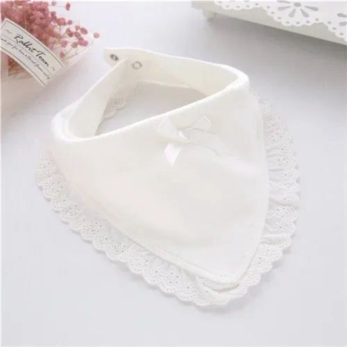 White lace bib for babies with decorative bow, designed for infants and toddlers