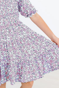 Lavender floral smocked dress for girls with ruffle hem and puff sleeves