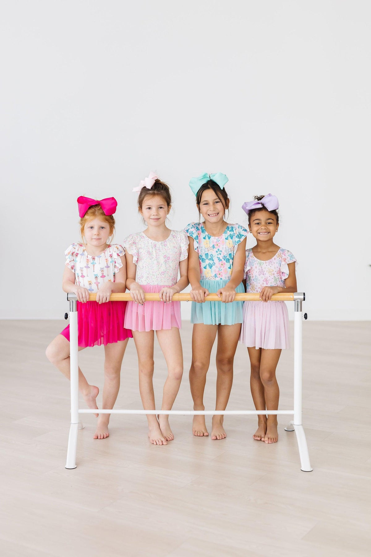 Girls pastel floral short sleeve twirl leotard leotard with mesh skirt in pink, light blue, and lavender sizes