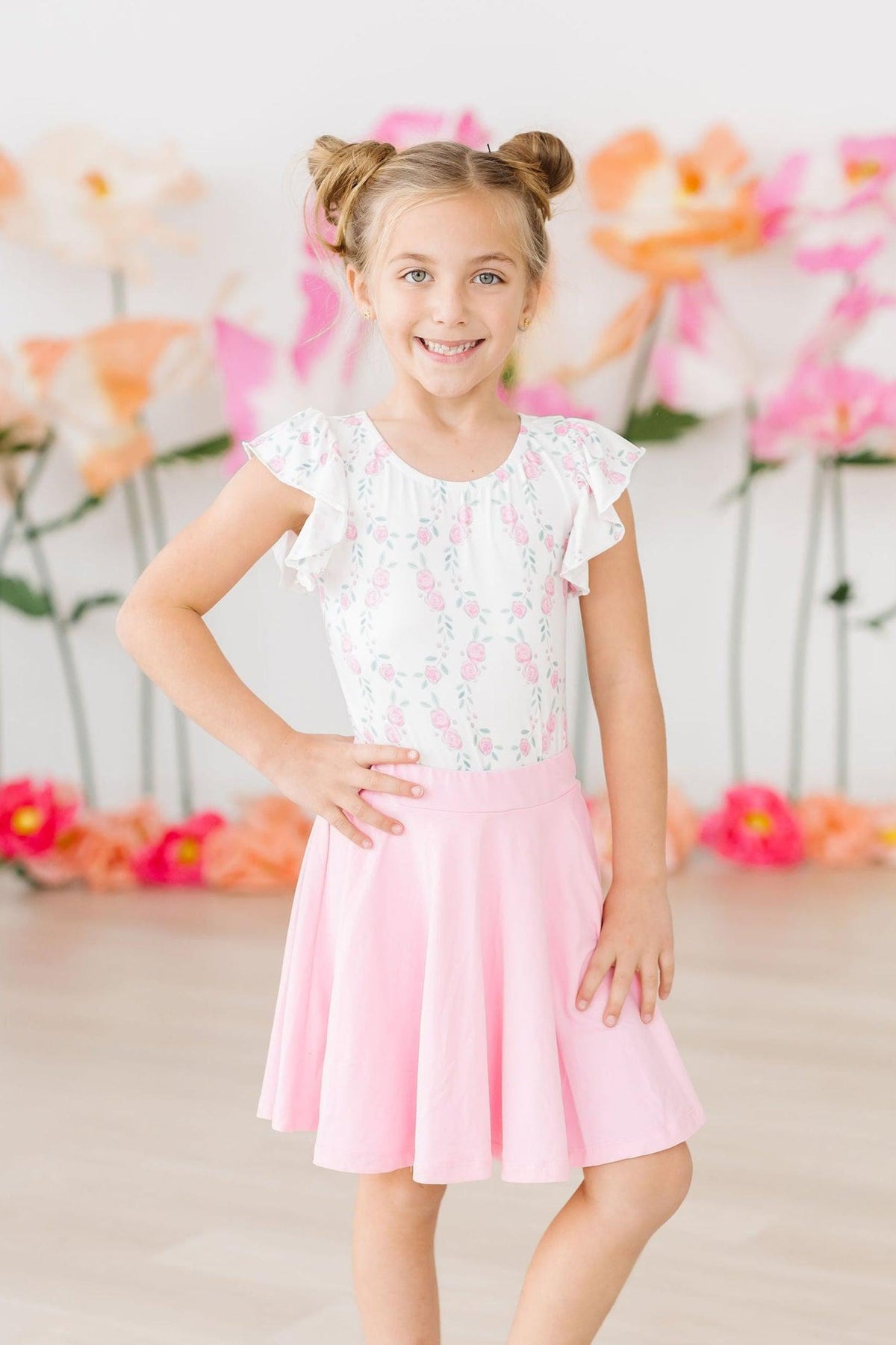 Girls white and pink flutter leotard leotard with floral print and short sleeves for young dancers