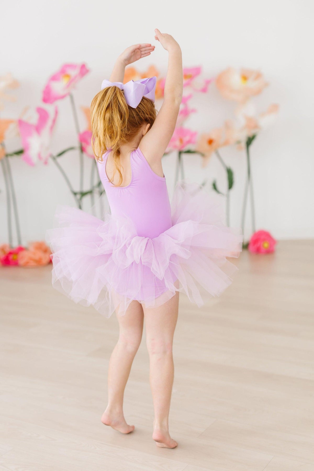 Mila & Rose girls lavender leotard tutu with layered tulle skirt and bow in hair