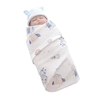 Lightweight cotton baby swaddle blanket in white with blue and beige animal and rocket prints for infants