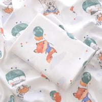 White lightweight cotton baby swaddle blanket with animal and balloon print for newborns