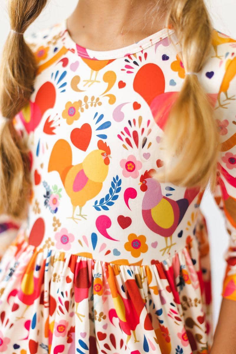 Mila & Rose little red hen girls dress with colorful hen print and 3/4 sleeves for young girls