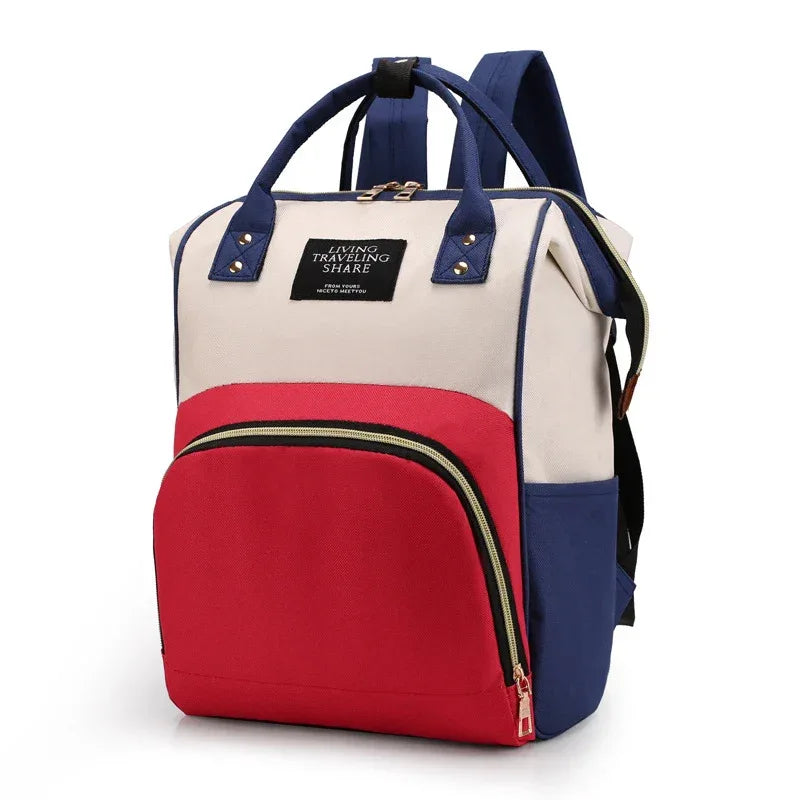 multifunctional insulated diaper bag in red blue and beige for babies with sturdy handles and backpack straps