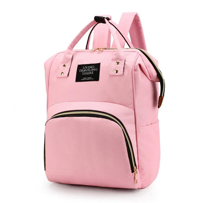 Pink multifunctional insulated diaper bag backpack for babies and kids with multiple compartments