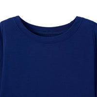 Close up of crew neck collar showing flat seam stitching on navy bamboo fabric