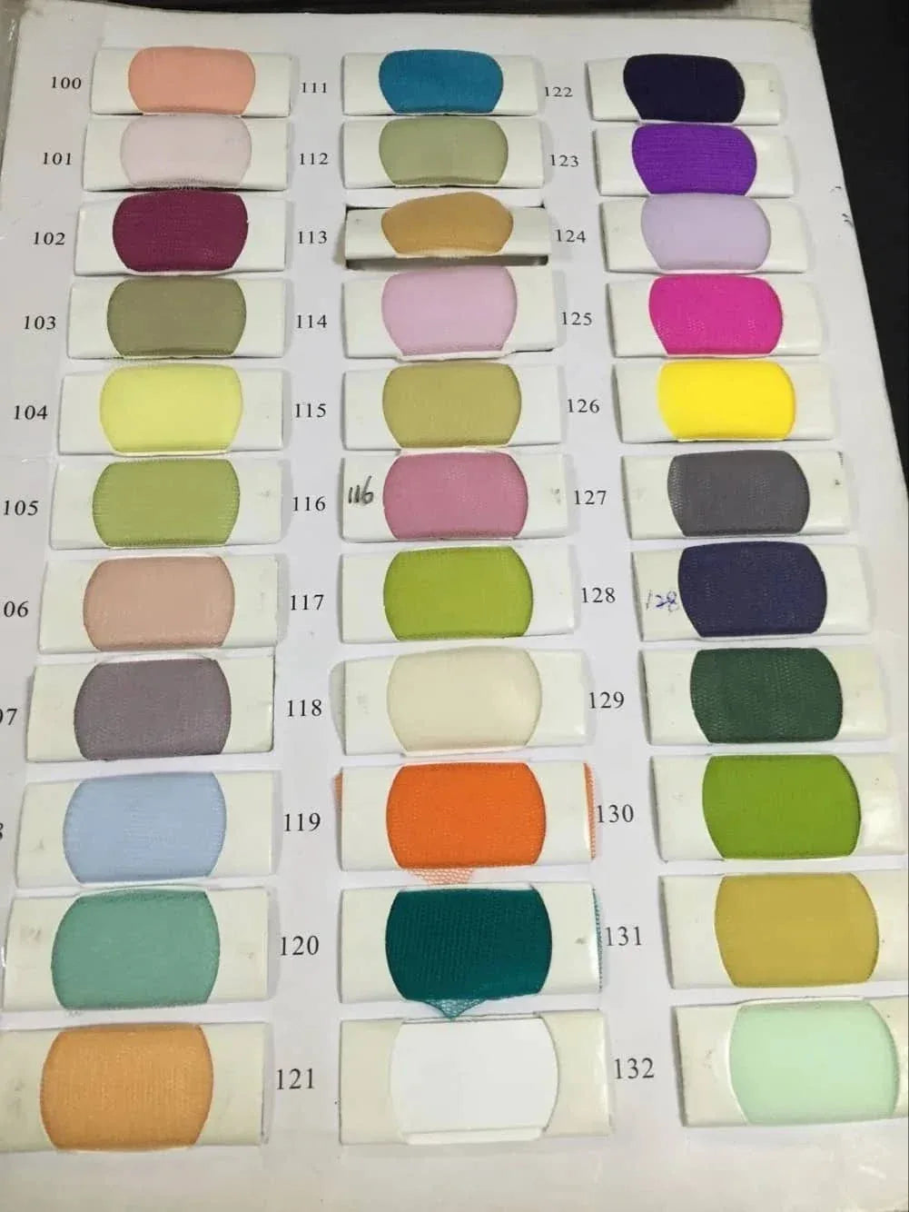 Various luxury lace christening gown fabric swatches in pastel and vibrant colors for babies and kids clothing