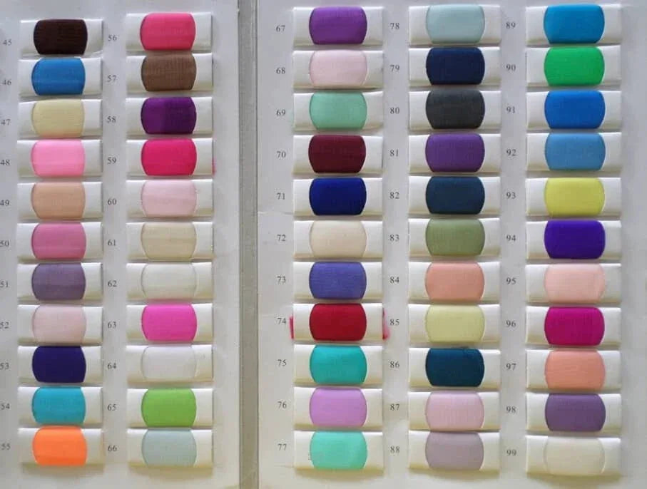 assorted colorful fabric swatches for babies and kids clothing in various shades and hues