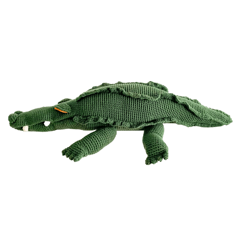 Large green crochet crocodile stuffed animal with a ridged back, toothy face, and organic cotton detail.