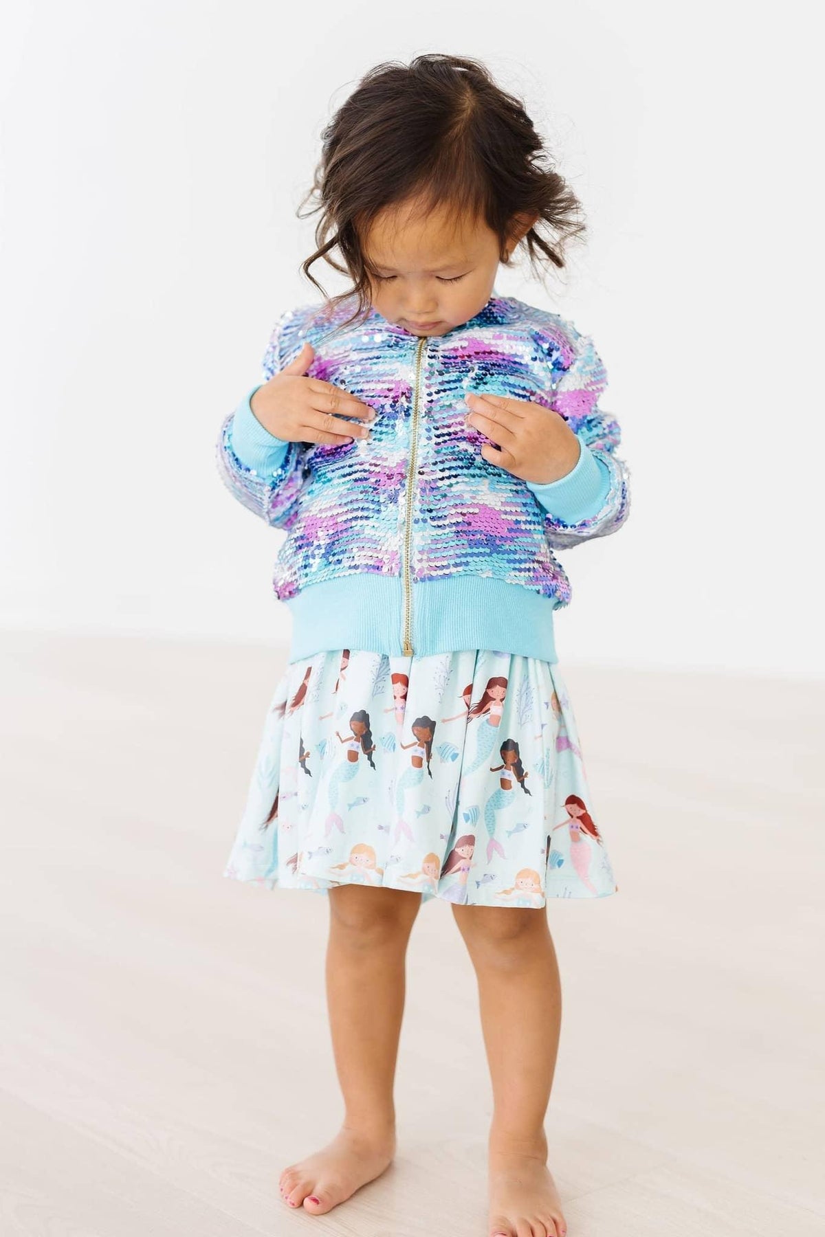 Girls mermaid sequin jacket for girls in blue and purple with long sleeves and zipper closure