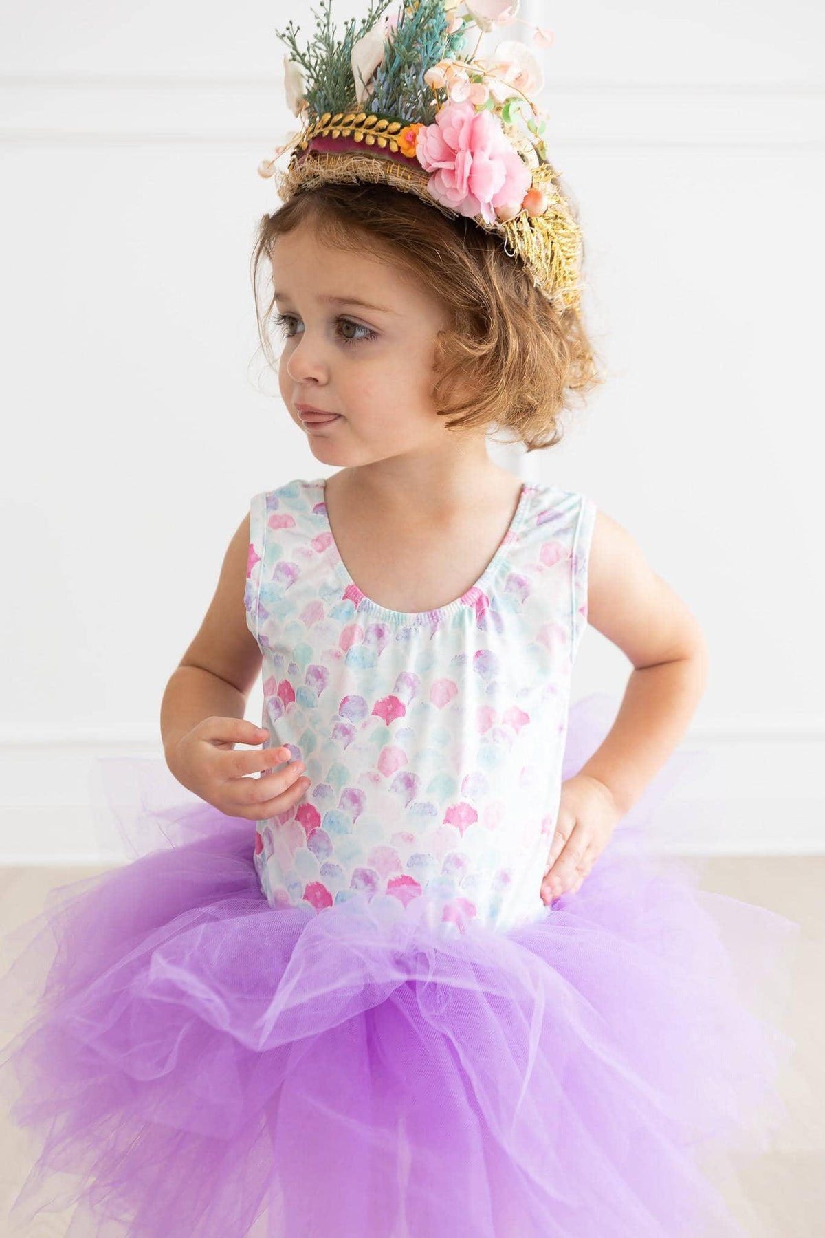 toddler girl wearing Mila & Rose mermaid tutu leotard for toddlers with white top and purple tutu skirt