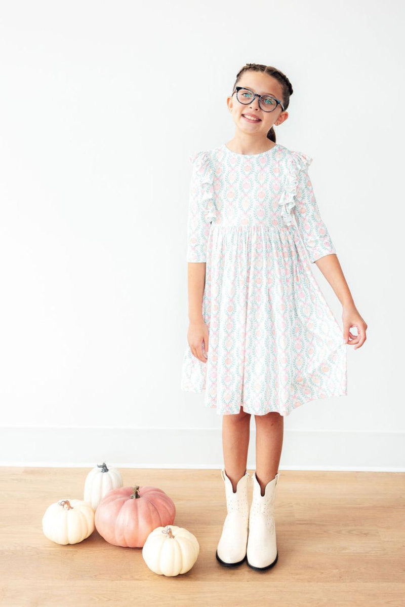 Little model twirling in the Pumpkin Kisses, Harvest Wishes 3/4 Sleeve Ruffle Twirl Dress - the ultimate fall wardrobe statement!