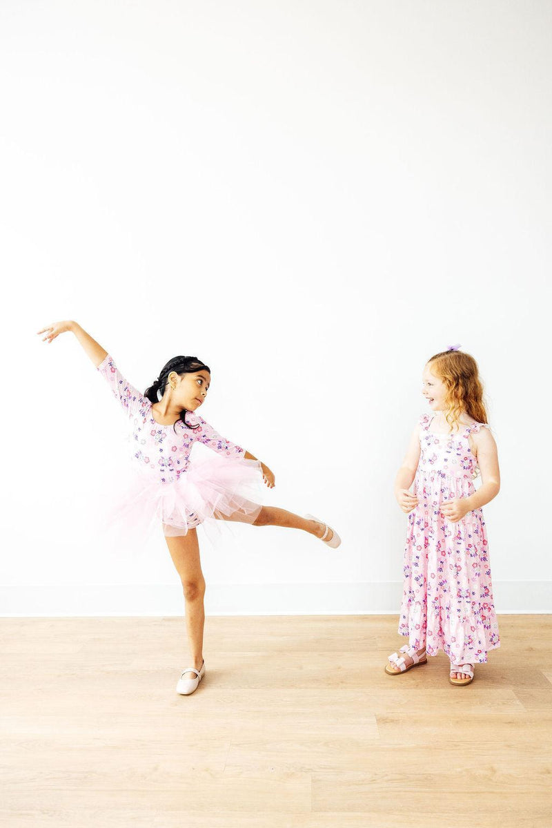 Vibrant close-up of the Retro Daydream 3/4 Sleeve Tutu Leotard from Mila & Rose, showcasing its adorable layers and playful design.