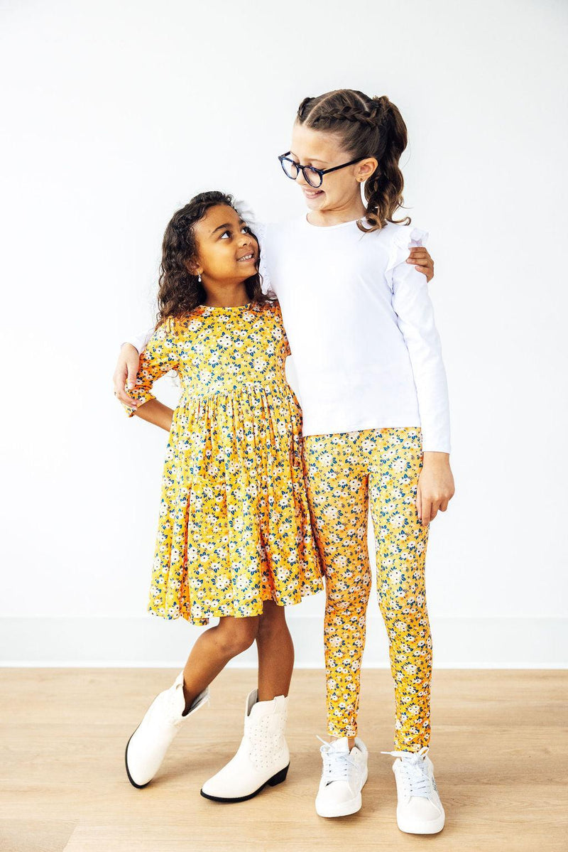Delightful details of the Fall Floral 3/4 Sleeve Pocket Twirl Dress showcasing pockets and a twirl-ready design from Mila & Rose.