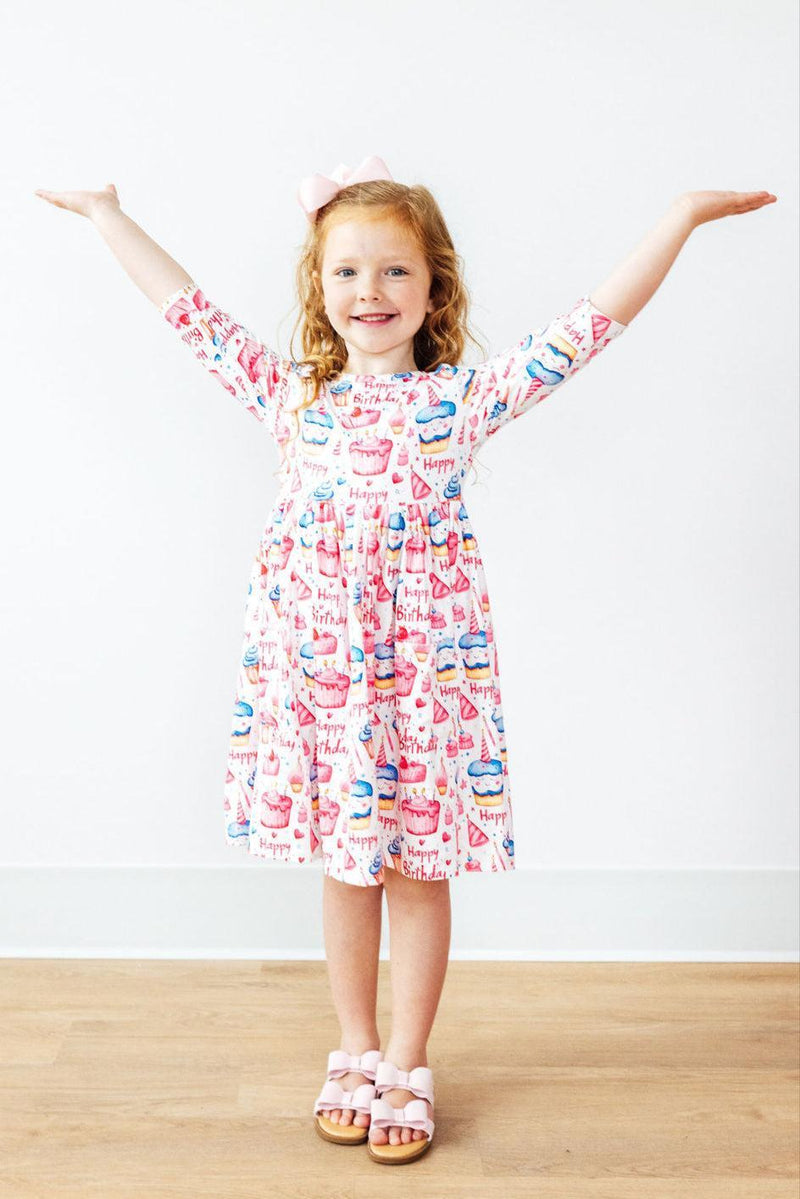Close-up of the soft stretch fabric of the Birthday Girl 3/4 Sleeve Pocket Twirl Dress by Mila & Rose, ideal for comfort and movement.