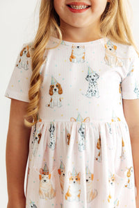 Pink short sleeve twirl dress with party pup dog print and pockets for toddlers