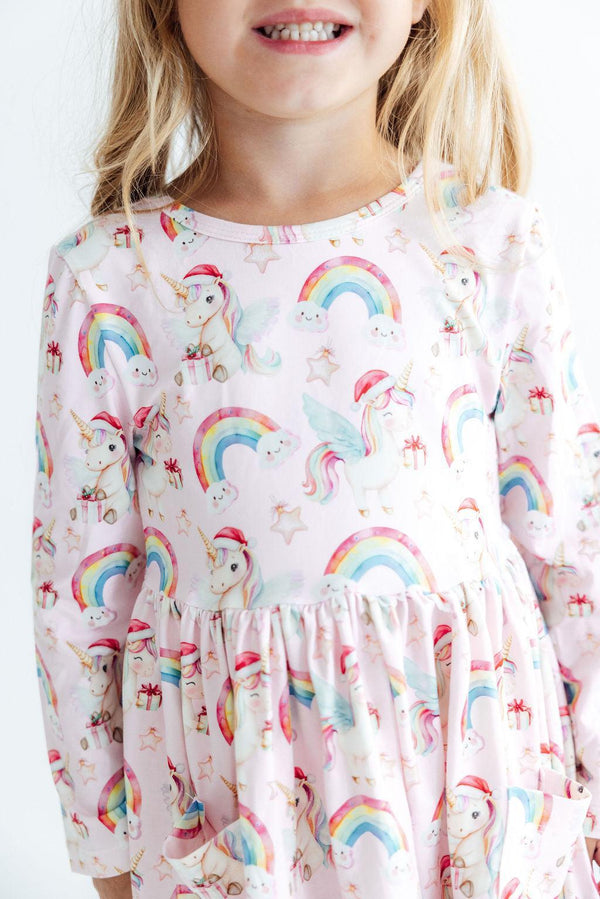 Pink long sleeve twirl dress with Christmas unicorn, rainbow, and star print for girls