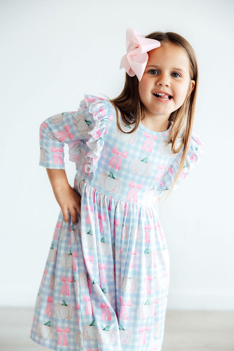 Adorable Pumpkin Picnic 3/4 Sleeve Ruffle Twirl Dress perfect for autumn adventures, showcasing twirl-worthy fun and a scoop back design.