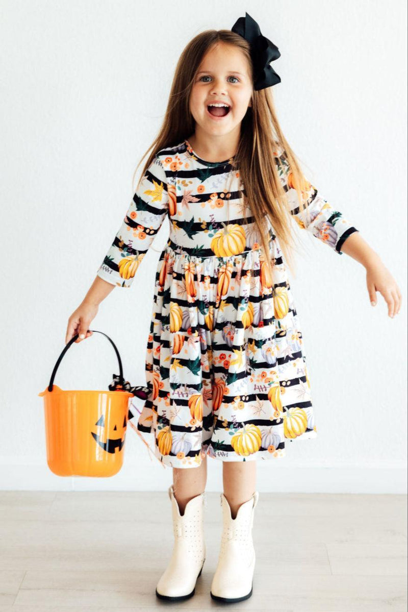 Close-up of the Pumpkins & Peonies 3/4 Sleeve Pocket Twirl Dress details featuring a charming ballet neckline and scoop back design.
