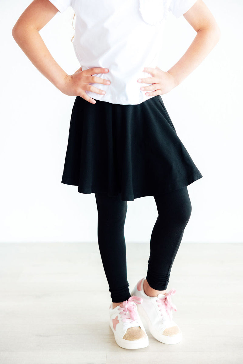 Chic Black Twirl Skegging for girls aged 2 to 10, featuring a stylish flounce skirt and snug full-length leggings, perfect for comfort and style during play and school.