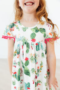 Cute Cactus Pom Pom Dress by Mila & Rose: white cactus-print dress with pink pom pom trim.