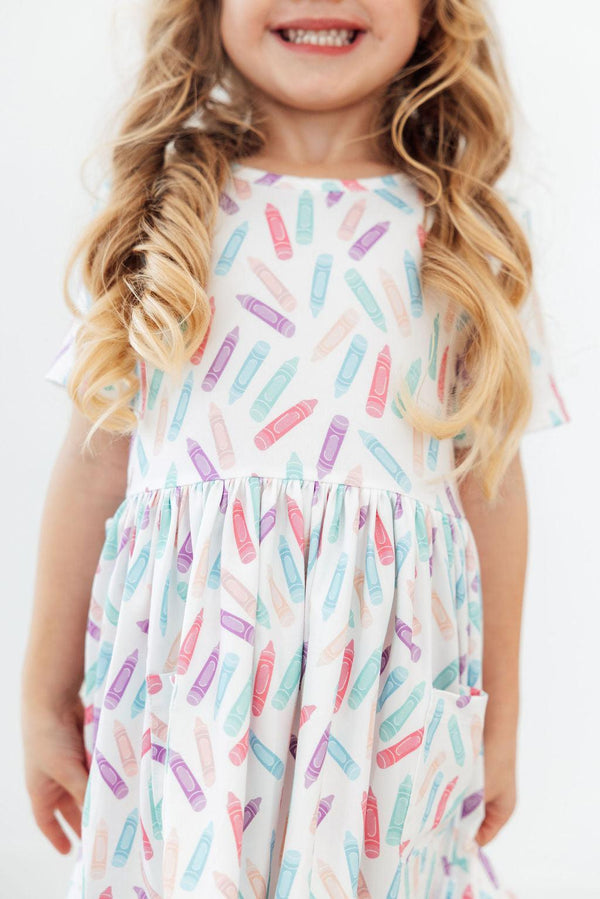 Color Crayons Short Sleeve Pocket Twirl Dress for Girls, perfect for playful twirls and everyday wear.