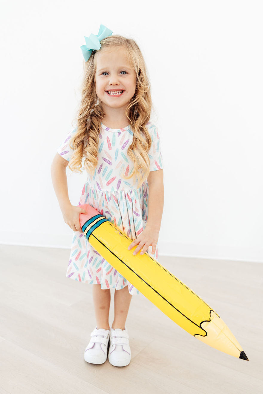 Girls enjoying movement in the Color Crayons Short Sleeve Pocket Twirl Dress, showcasing its twirl-with-me style.