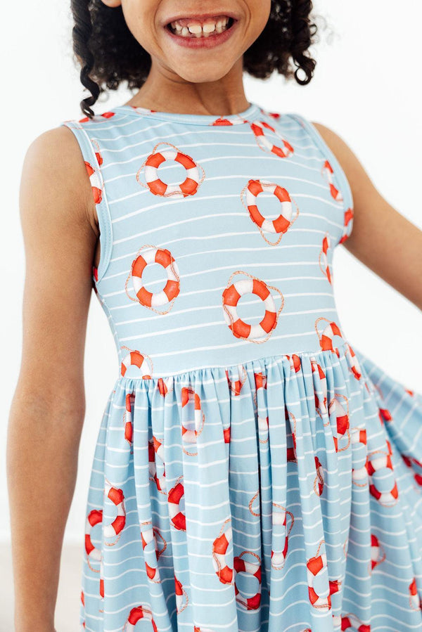 Little Lifeguard Playful Tank Twirl Dress for Girls showcasing a vibrant design perfect for sunny days. Ideal playful tank dress for school or play.