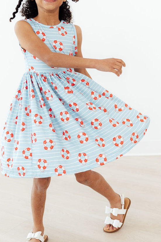 Close-up view of the Little Lifeguard Playful Tank Twirl Dress for Girls highlighting its comfortable fabric and twirl-friendly silhouette—perfect playful tank dress.